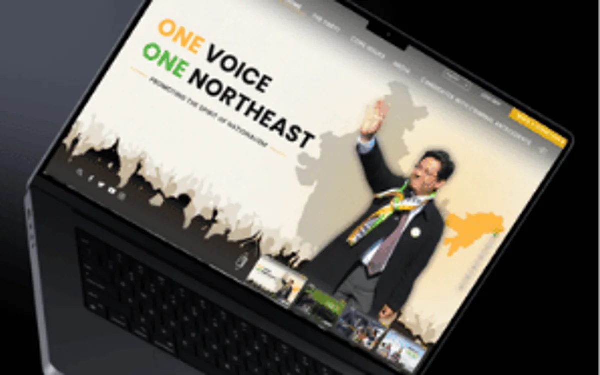 A laptop showing the National People's Party homepage: the 'One Voice One Northeast' hero over a map of India